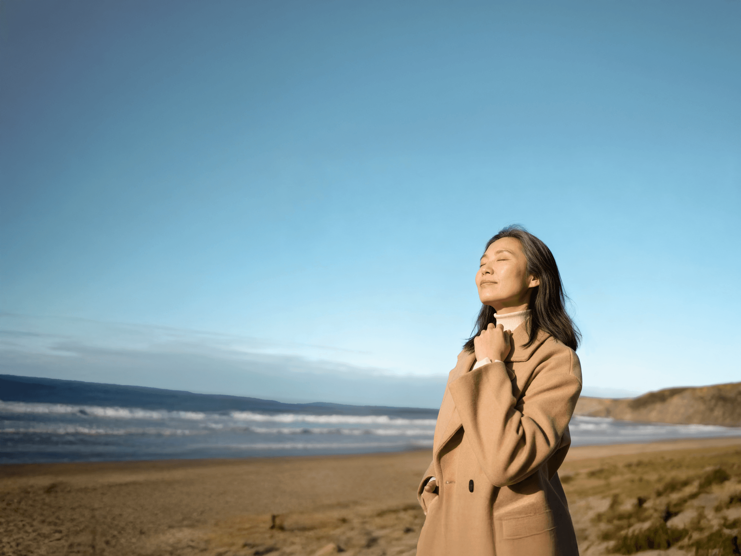 Woman at peace on beach