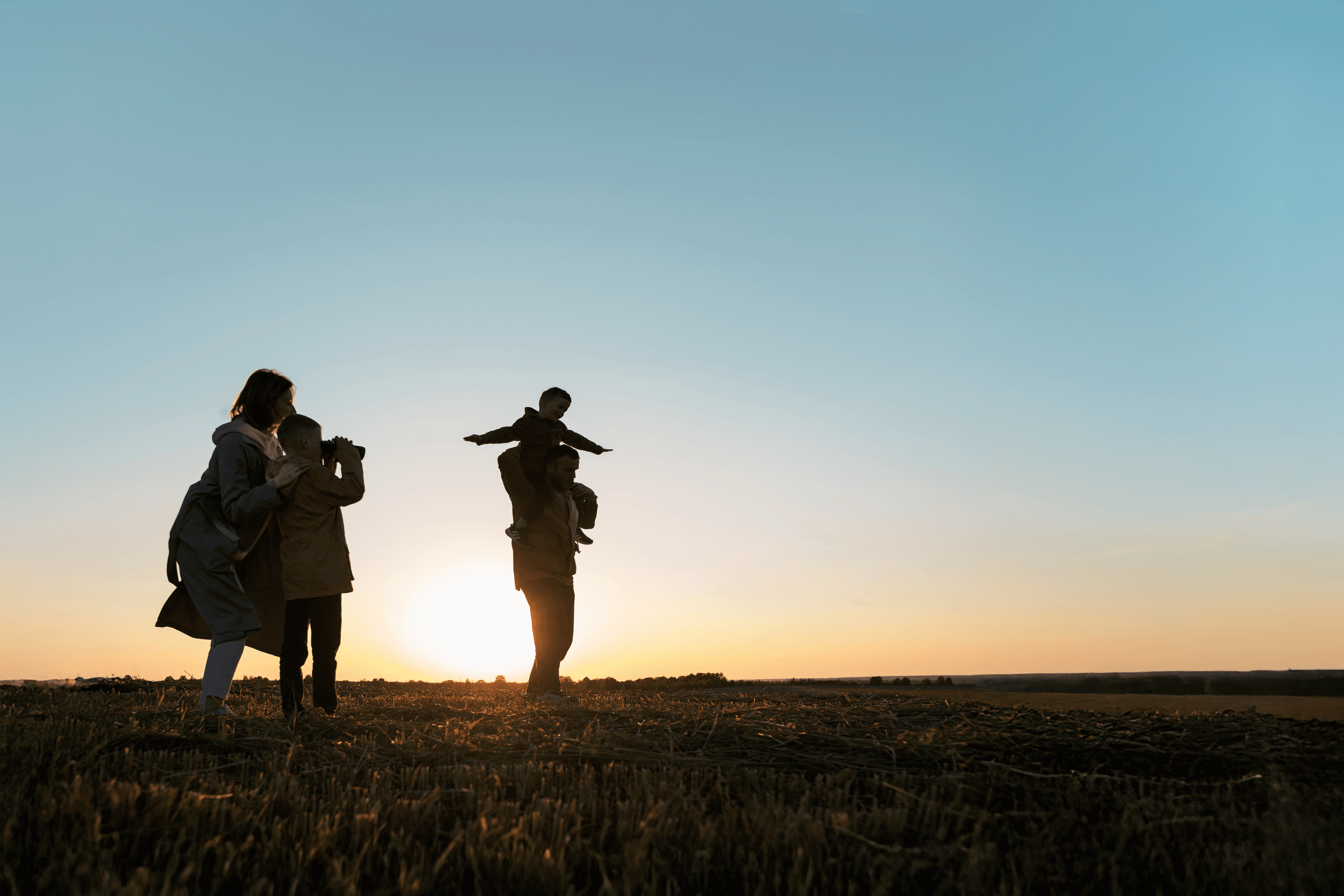 Family silhouette at sunset