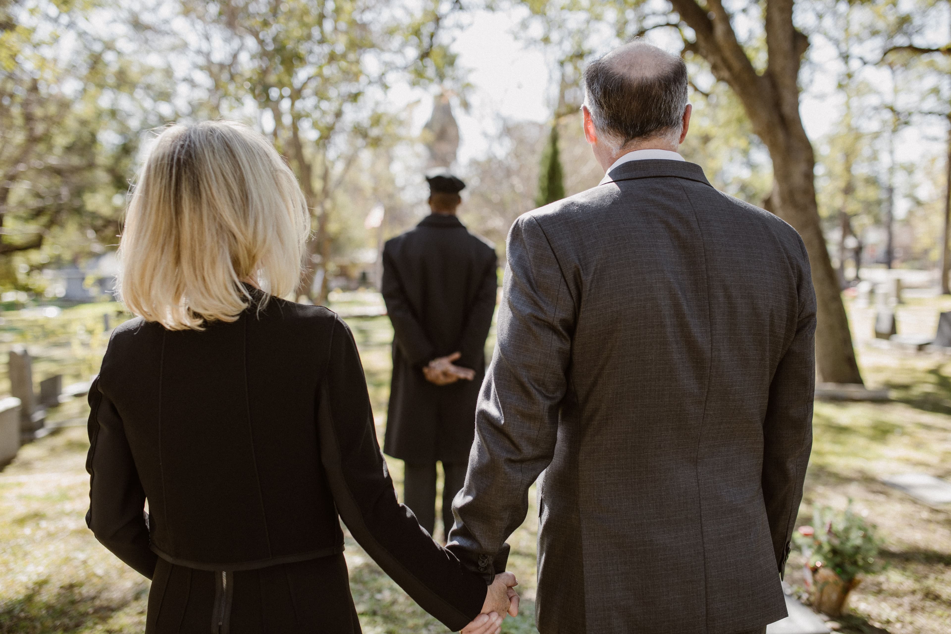 Family gathered graveside during a funeral service